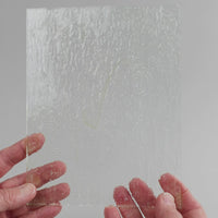 Video of the clear ripple glass plate in white transparant, 15x19cm, held up and tilted to show its pattern and transparency