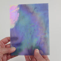 Video of the Hydrangea glass plate in iridescent translucent blue, 15x19cm, held up and tilted to show its pattern and transparency