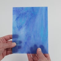 Video of the Dream Blue glass plate in translucent blue, 15x19cm, held up and tilted to show its pattern and transparency