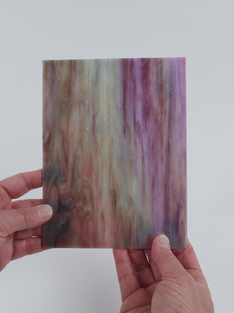Video of the Hyacinth glass plate in translucent purple, 15x19cm, held up and tilted to show its pattern and transparency