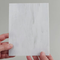 Video of the pale grey marble glass plate in grey marbled translucent, 15x19cm, held up and tilted to show its pattern and transparency