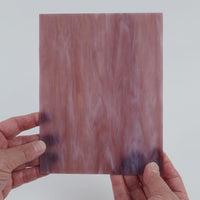 Video of the Pale Violet Streaky glass plate in translucent purple, 15x19cm, held up and tilted to show its pattern and transparency