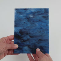 Video of the Indigo Charcoal glass plate in translucent blue, 15x19cm, held up and tilted to show its pattern and transparency