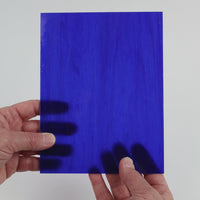 Video of the Lapis Lazulli glass plate in translucent blue, 15x19cm, held up and tilted to show its pattern and transparency