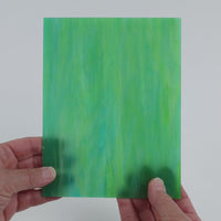 Video of the Lagoon glass plate in translucent teal, 15x19cm, held up and tilted to show its pattern and transparency