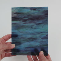 Video of the Indigo Mist glass plate in translucent blue, 15x19cm, held up and tilted to show its pattern and transparency