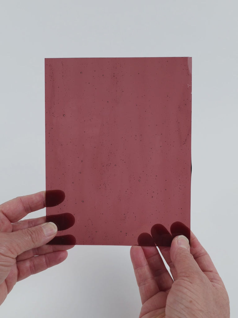 Video of the Clear Violet glass plate in transparent purple, 15x19cm, held up and tilted to show its pattern and transparency