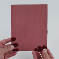 Video of the Clear Violet glass plate in transparent purple, 15x19cm, held up and tilted to show its pattern and transparency