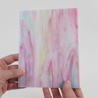 Video of the Sugared Almonds glass plate in translucent pink, 15x19cm, held up and tilted to show its pattern and transparency