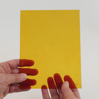 Video of the Golden Brown glass plate in transparant brown, 15x19cm, held up and tilted to show its pattern and transparency